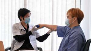 Patient doing exercise treatment with his physiotherapist.